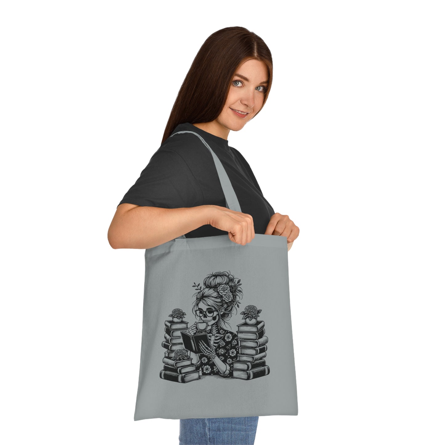 Skeleton reading a book tote bag