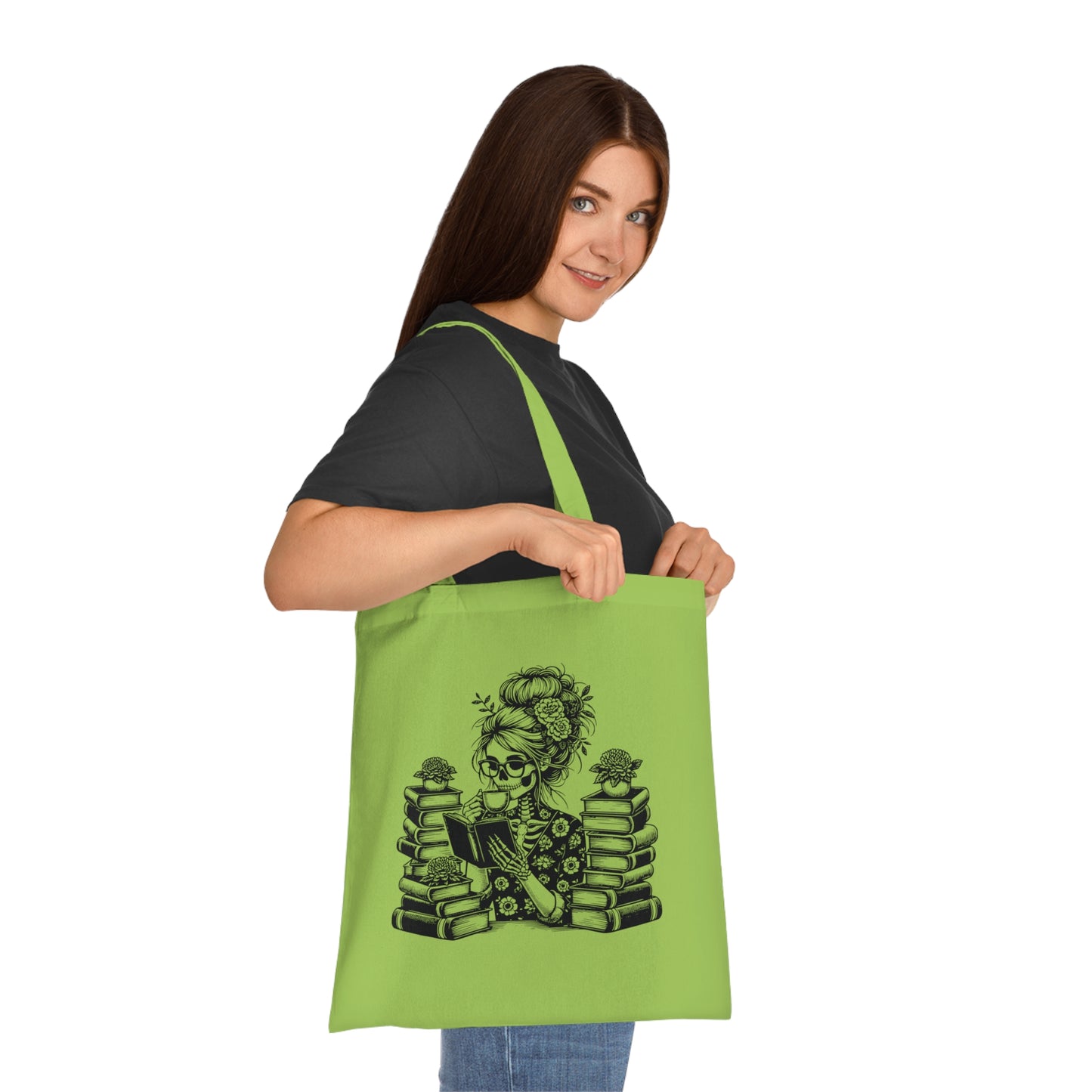 Skeleton reading a book tote bag