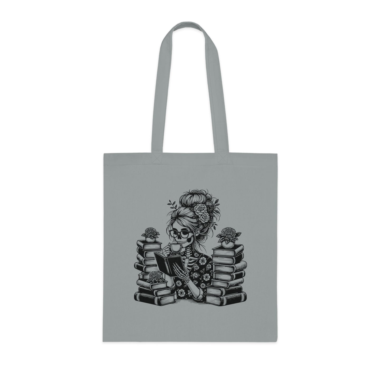 Skeleton reading a book tote bag